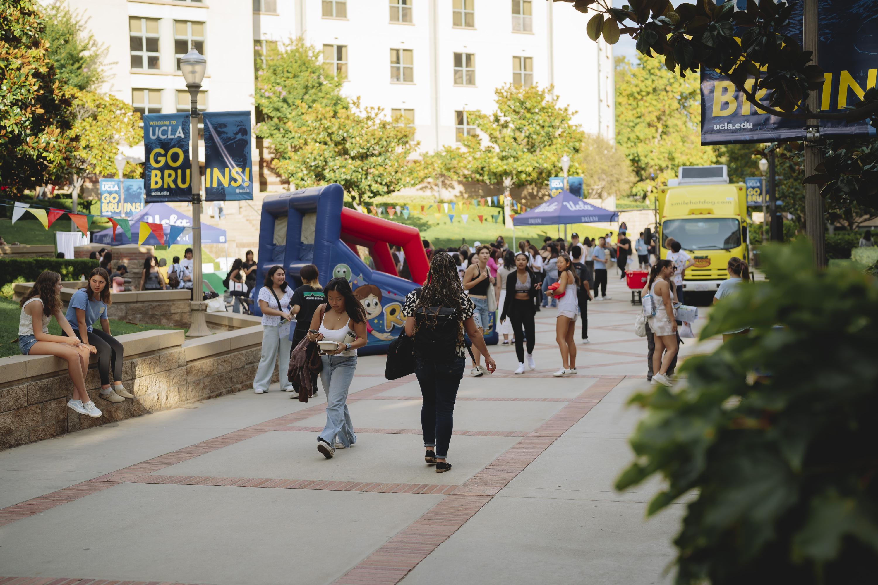 de neve plaza full of students with bouncy house