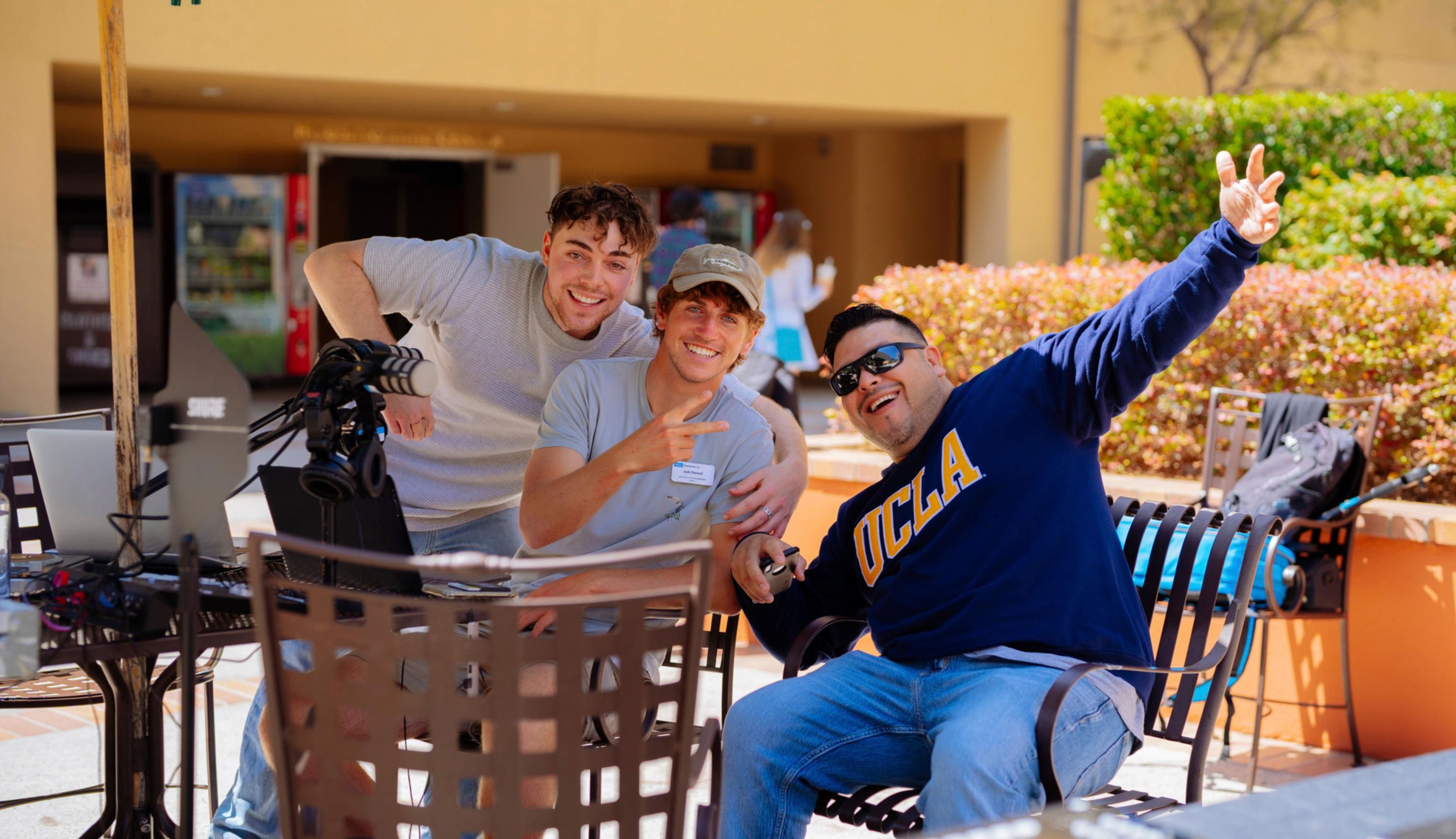 3 students posing at camera, smiling, and having fun
