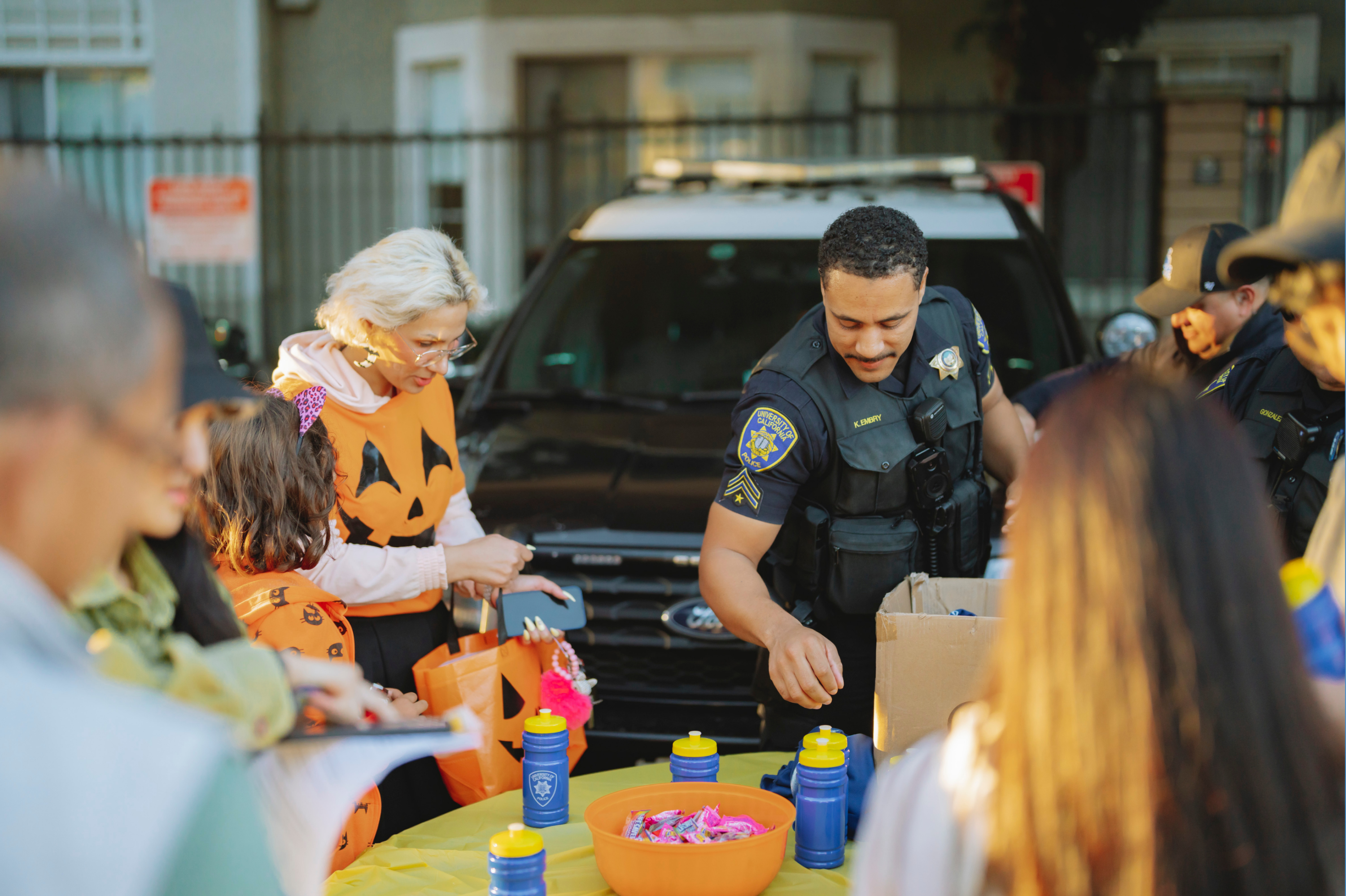 A policeman and citizens enjoying arts and crafts activities