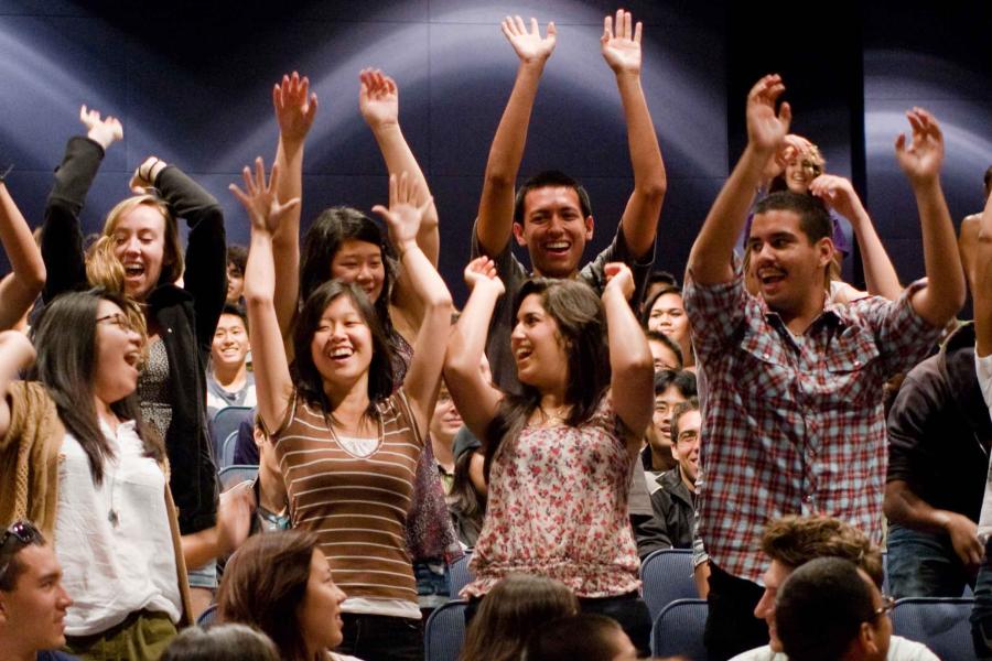 Students cheering in auditorium